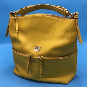 Luxurious yellow Dooney & Bourke shoulder bag.